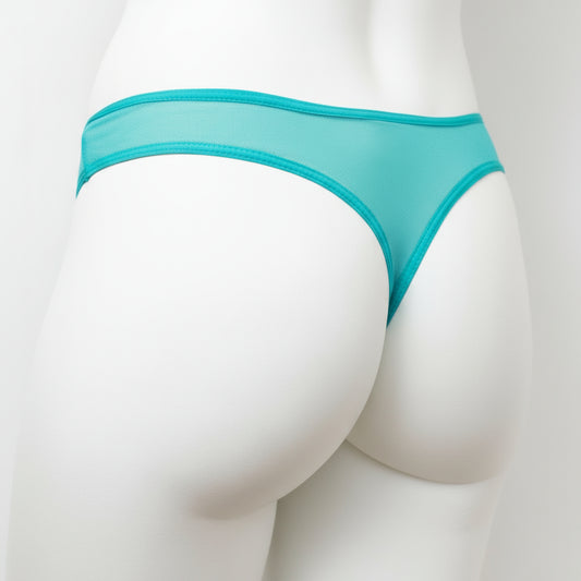 Teal underwear on a mannequin against a white background
