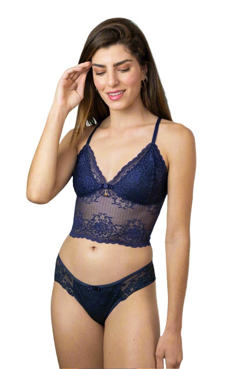 Woman wearing a navy blue lace lingerie set on a white background