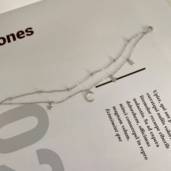 Sterling Silver Rhodium Plated Moon And Stars Charm Bracelet ERLB019